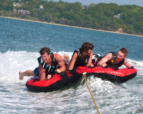 Tubing with Peconic Water Sports on a boat charter in the Hamptons near Sag Harbor, NY